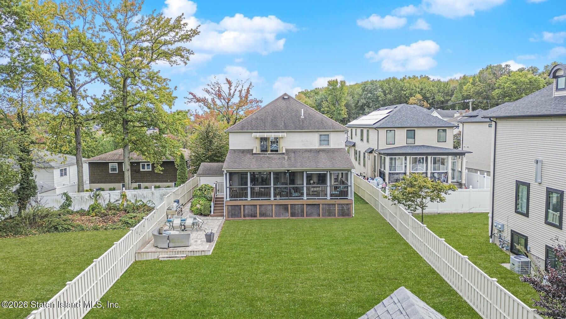 63 Finlay Avenue Staten Island, NY 10309 - Photo 41 of 44 a front view of a house with a yard table and chairs