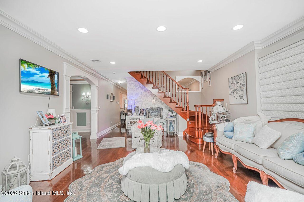 63 Finlay Avenue Staten Island, NY 10309 - Photo 6 of 44 a living room with furniture and a wooden floor