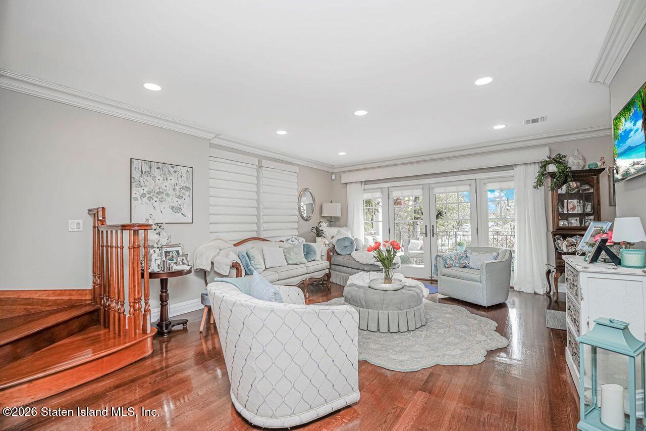 63 Finlay Avenue Staten Island, NY 10309 - Photo 7 of 44 a living room with furniture floor to ceiling window and wooden floor