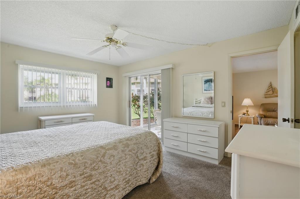 5467 Rattlesnake Hamm Road, Unit C105 Naples, FL 34113 - Photo 8 of 14 PRIMARY BEDROOM SUITE - UPDATED IMPACT WINDOW