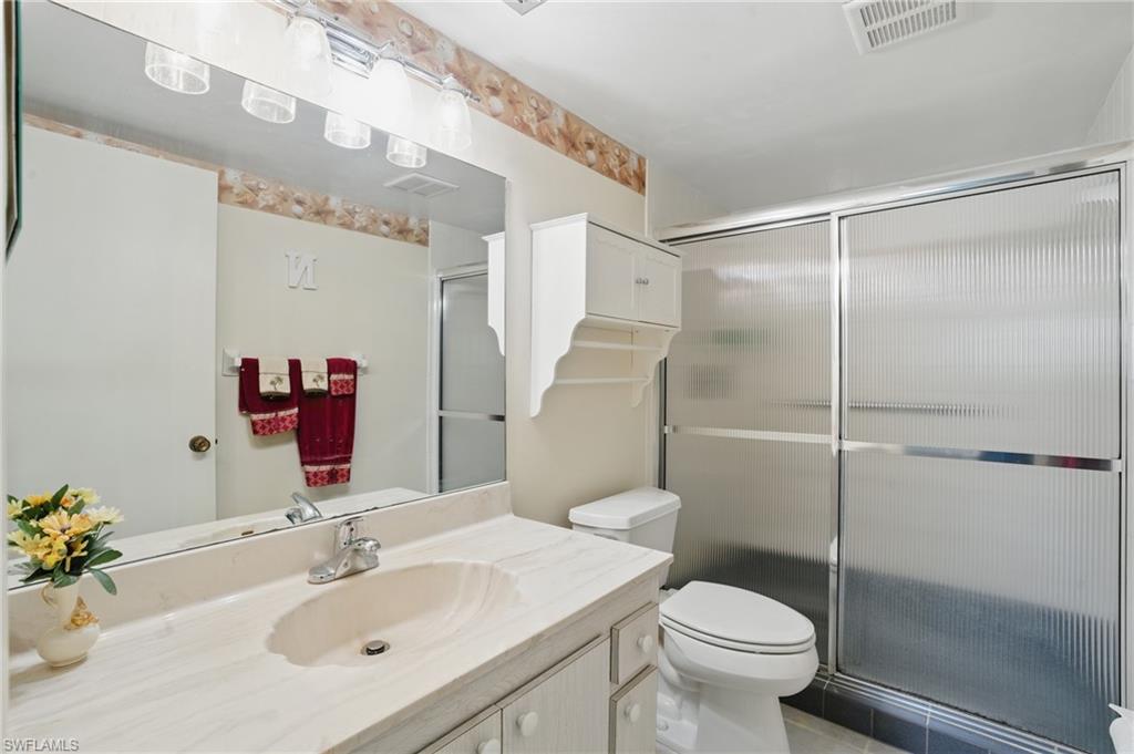 5467 Rattlesnake Hamm Road, Unit C105 Naples, FL 34113 - Photo 10 of 14 ENSUITE BATH WITH SHOWER