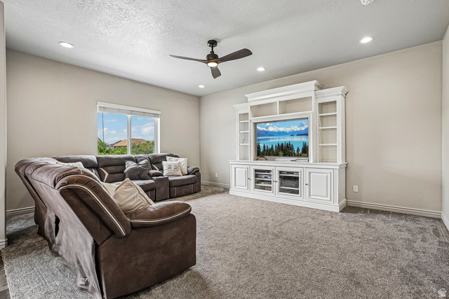 203 North 1900th Street West Mapleton, UT 84664 - Photo 6 of 48 Recessed lighting illuminating a spacious room with light gray walls and gray carpeting