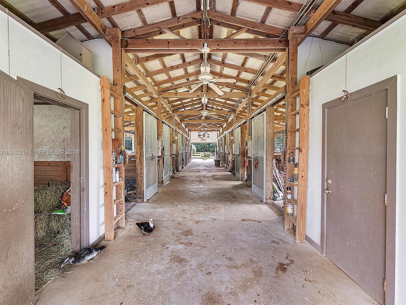 14490 Stirling Road Southwest Ranches, FL 33330 - Photo 17 of 52 Tack room on right Feed room on left