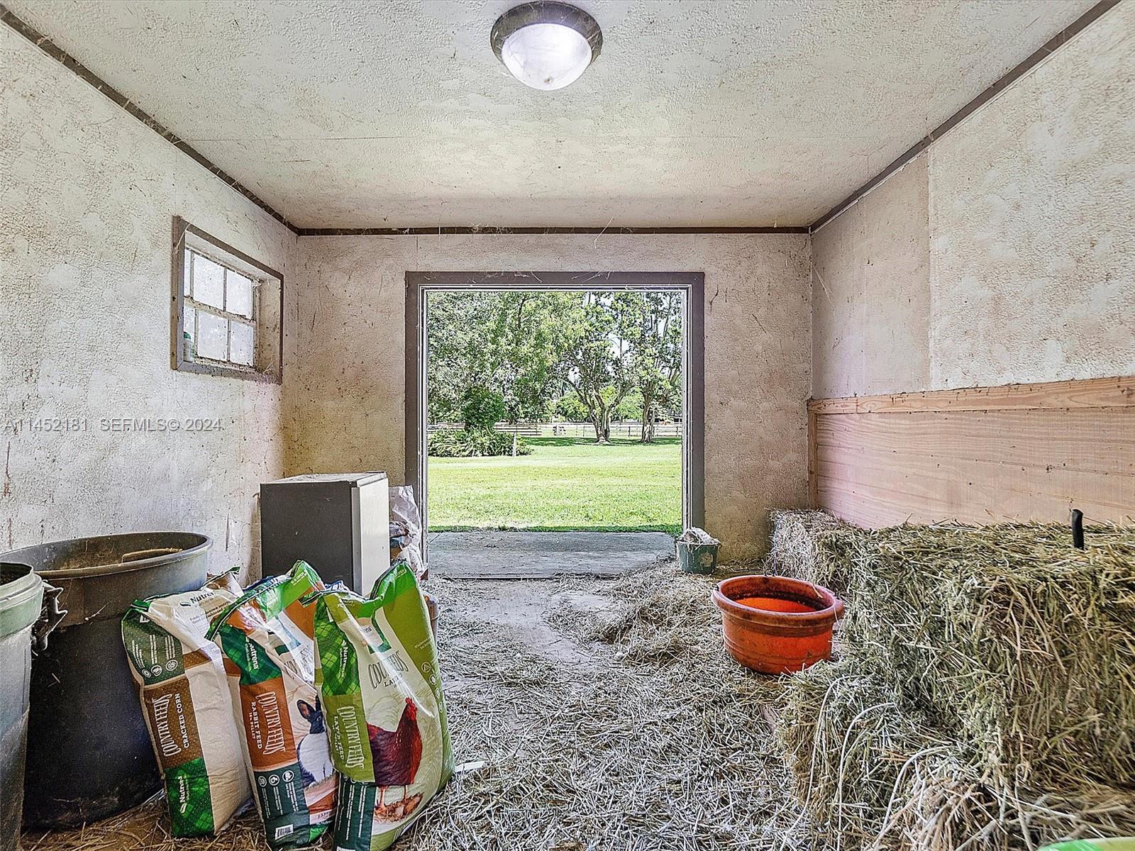 14490 Stirling Road Southwest Ranches, FL 33330 - Photo 19 of 52 Feed room outside door for easy delivery