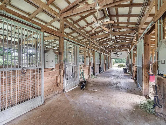a view of an empty room with wooden walls