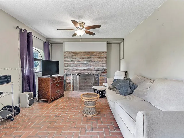 a kitchen with a sink cabinets and window