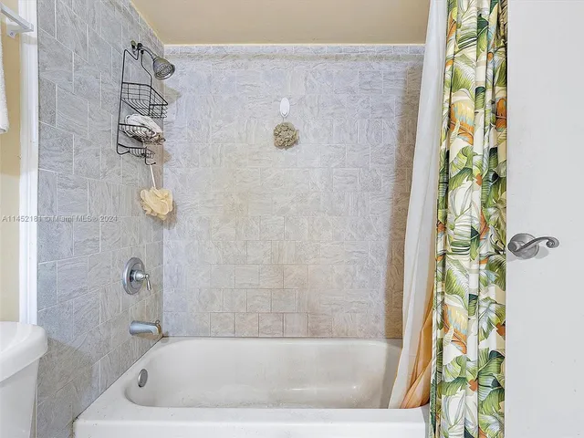 a view of a lake with a big yard and potted plants