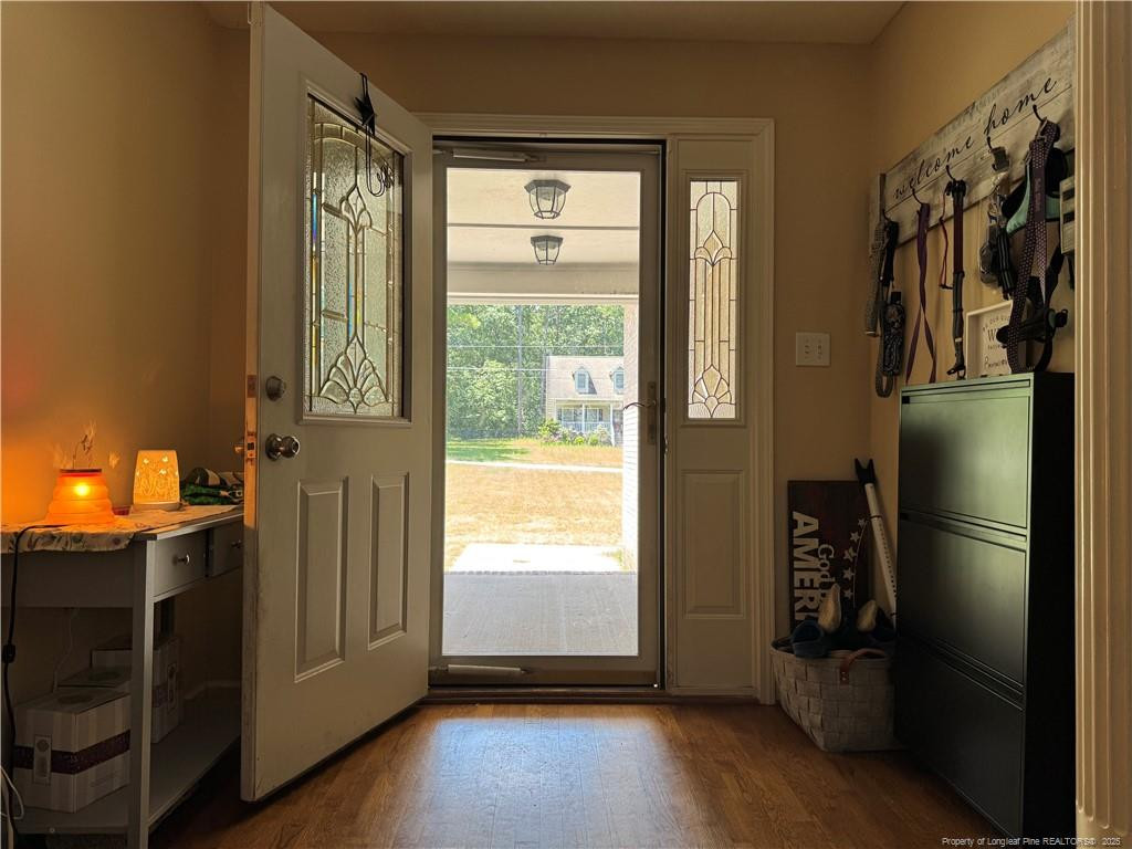 912 Lewis Street Raeford, NC 28376 - Photo 13 of 45 a view of a room with wooden floor and windows