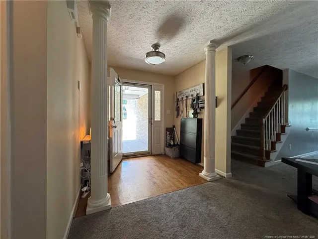 a view of a hallway view with staircase