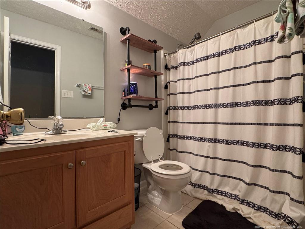 912 Lewis Street Raeford, NC 28376 - Photo 44 of 45 a bathroom with a sink toilet and shower