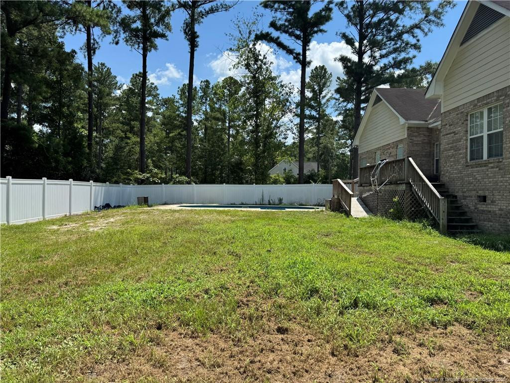 912 Lewis Street Raeford, NC 28376 - Photo 9 of 45 a view of a backyard with a tree