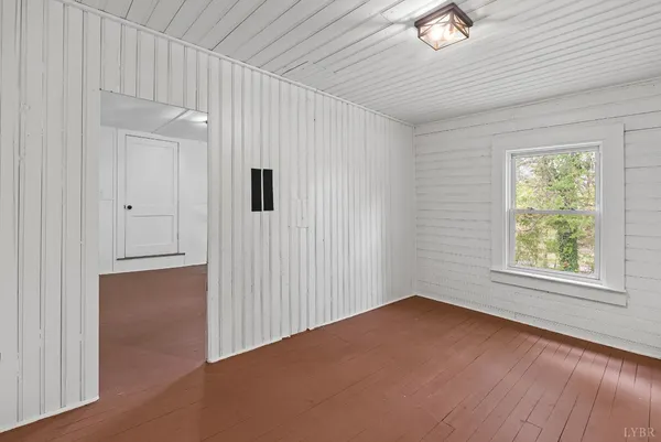 an empty room with a empty space and windows