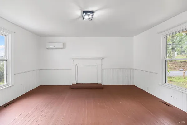 an empty room with a empty space and window