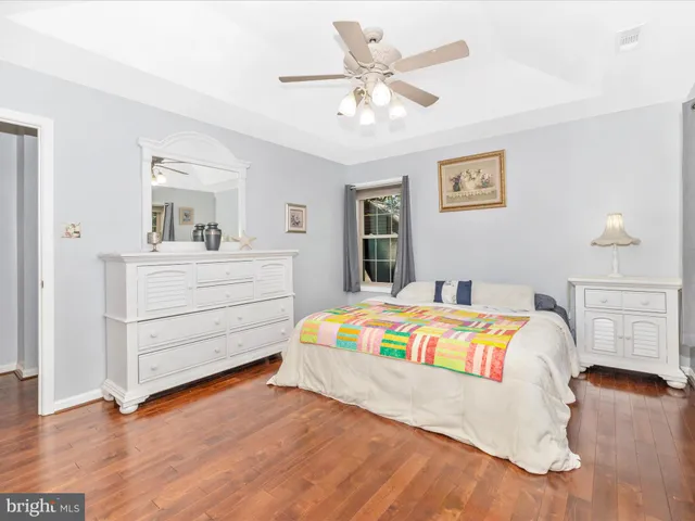 a view of a house with backyard and a tree