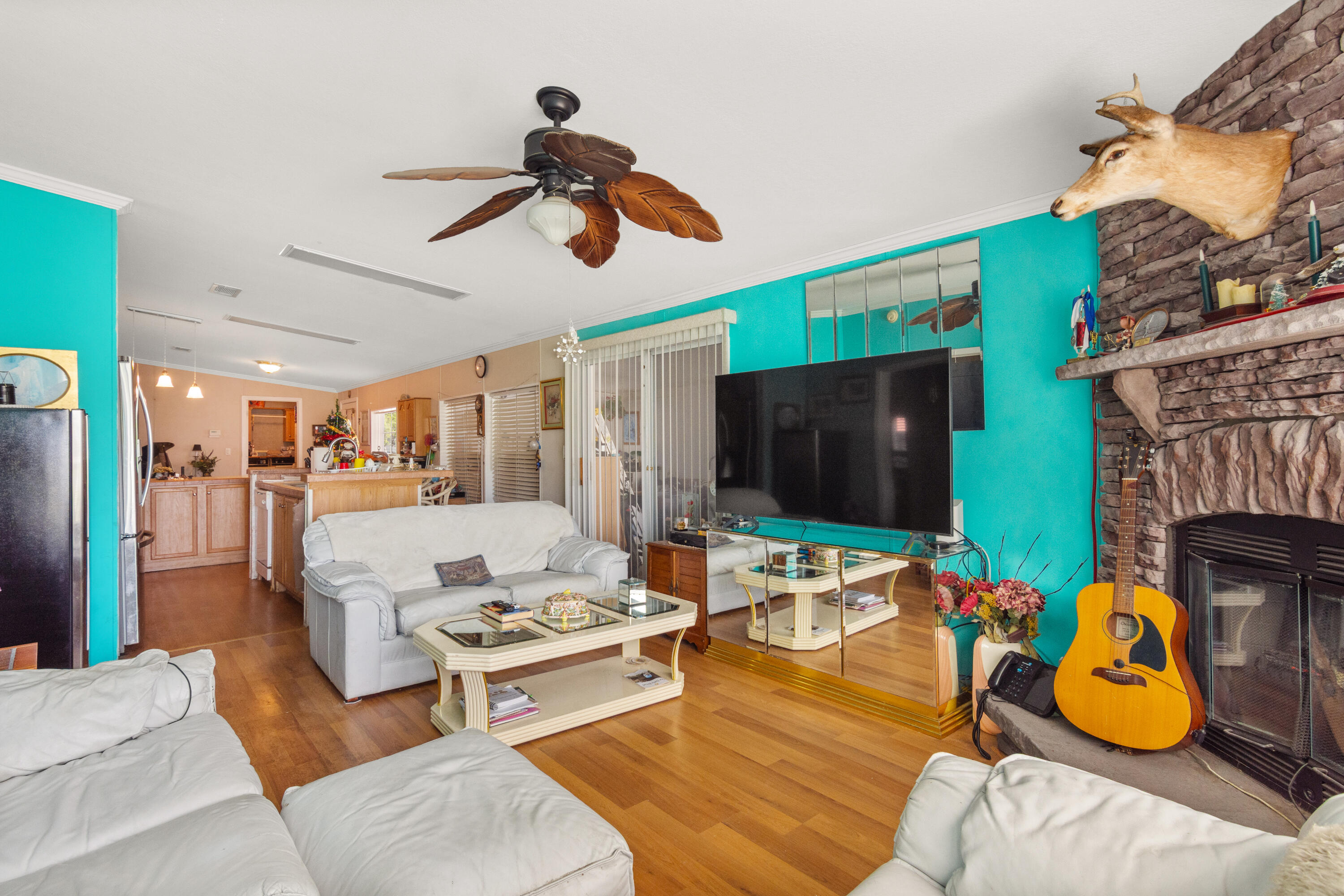 18 Nuevo Leon Road Port St. Lucie, FL 34952 - Photo 12 of 36 a living room with furniture and a flat screen tv