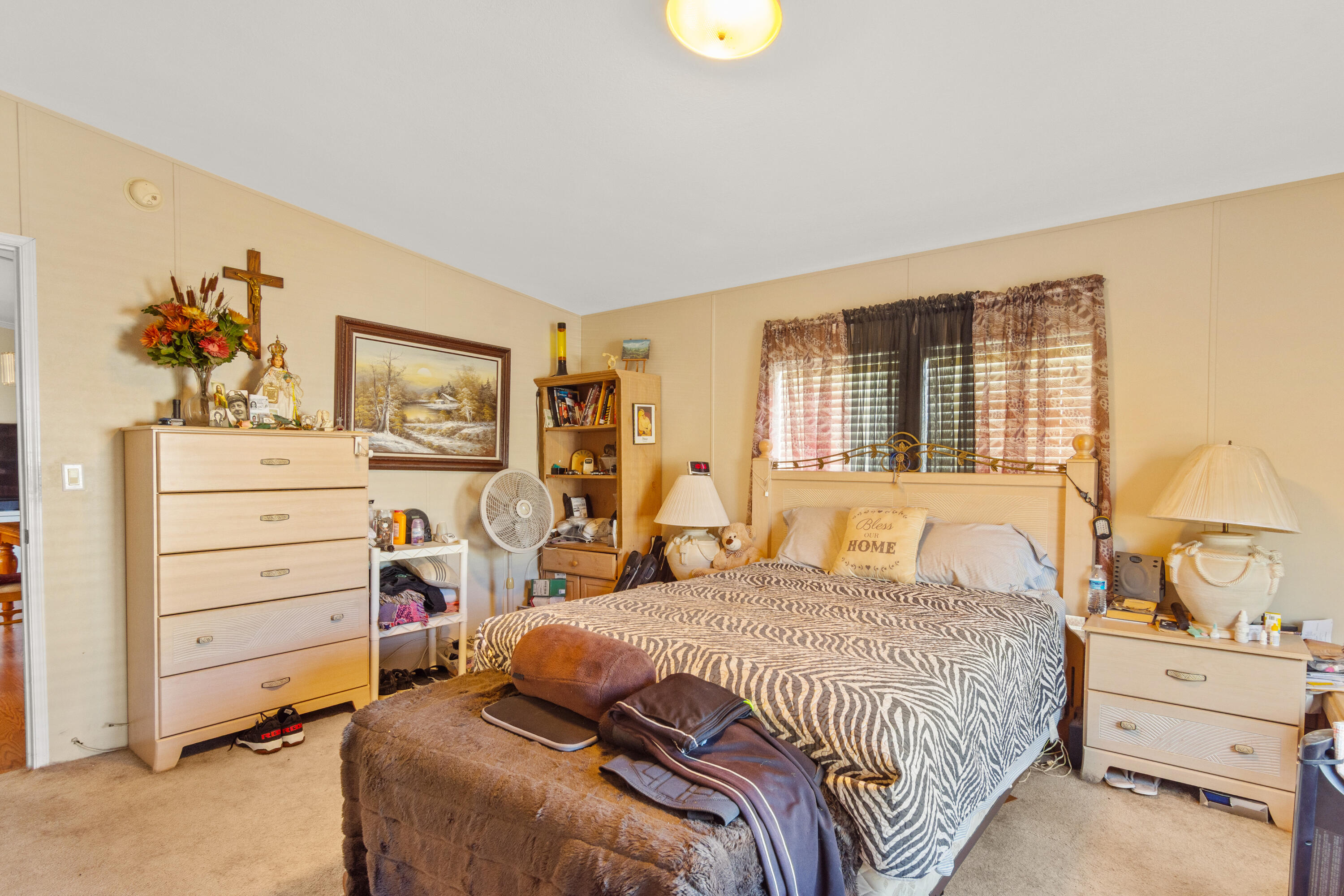 18 Nuevo Leon Road Port St. Lucie, FL 34952 - Photo 13 of 36 a bedroom with a bed and a dresser
