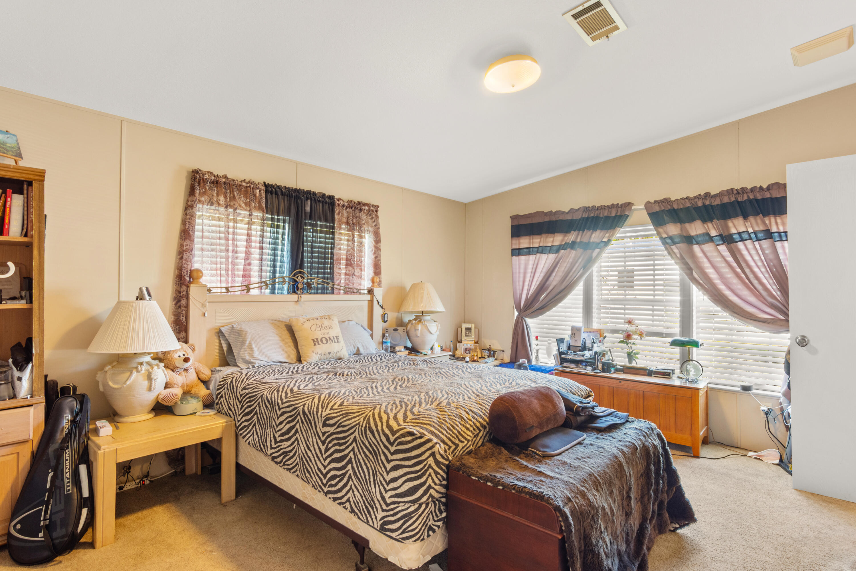18 Nuevo Leon Road Port St. Lucie, FL 34952 - Photo 14 of 36 a bedroom with a bed and a large window