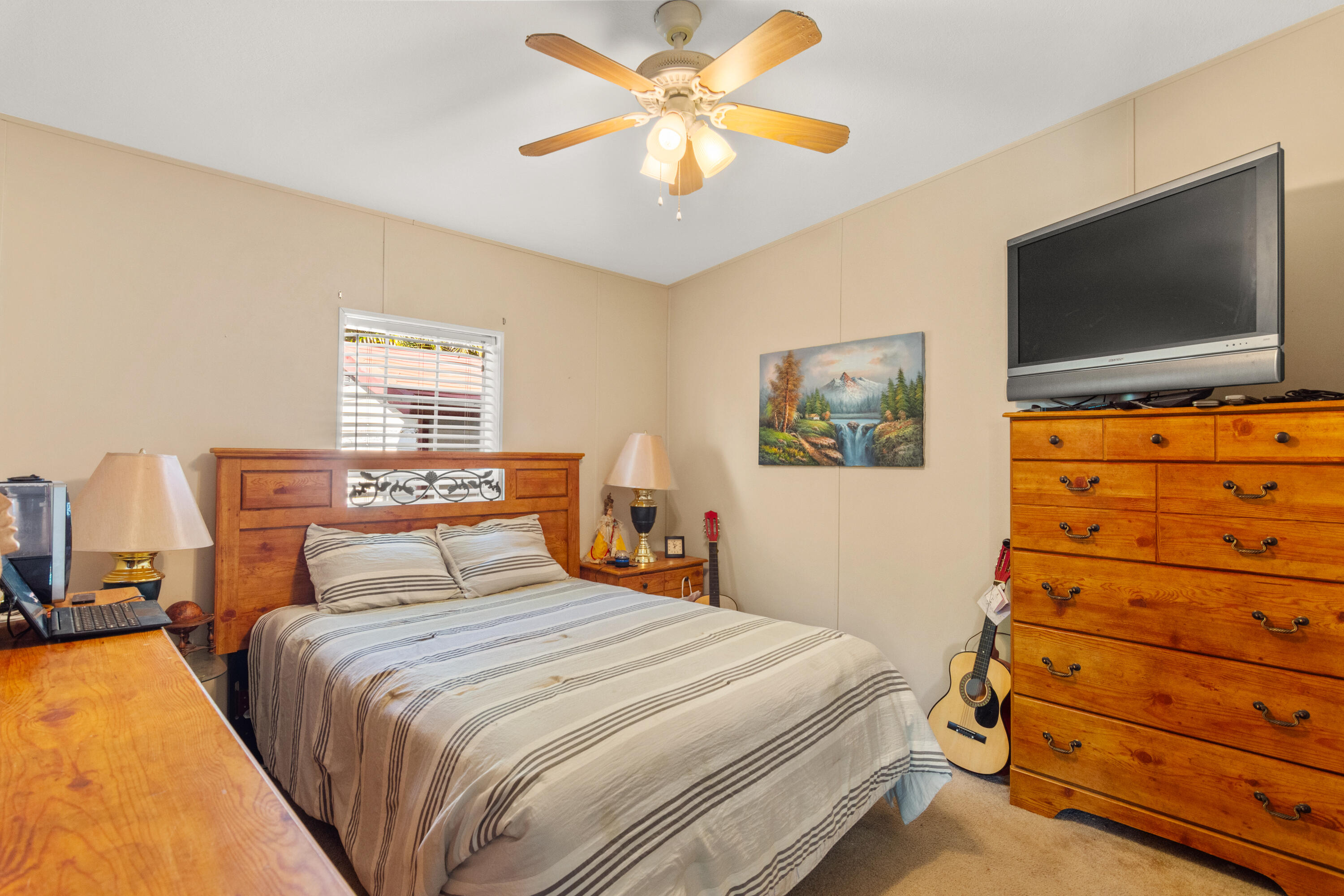 18 Nuevo Leon Road Port St. Lucie, FL 34952 - Photo 17 of 36 a bedroom with a bed and a flat screen tv