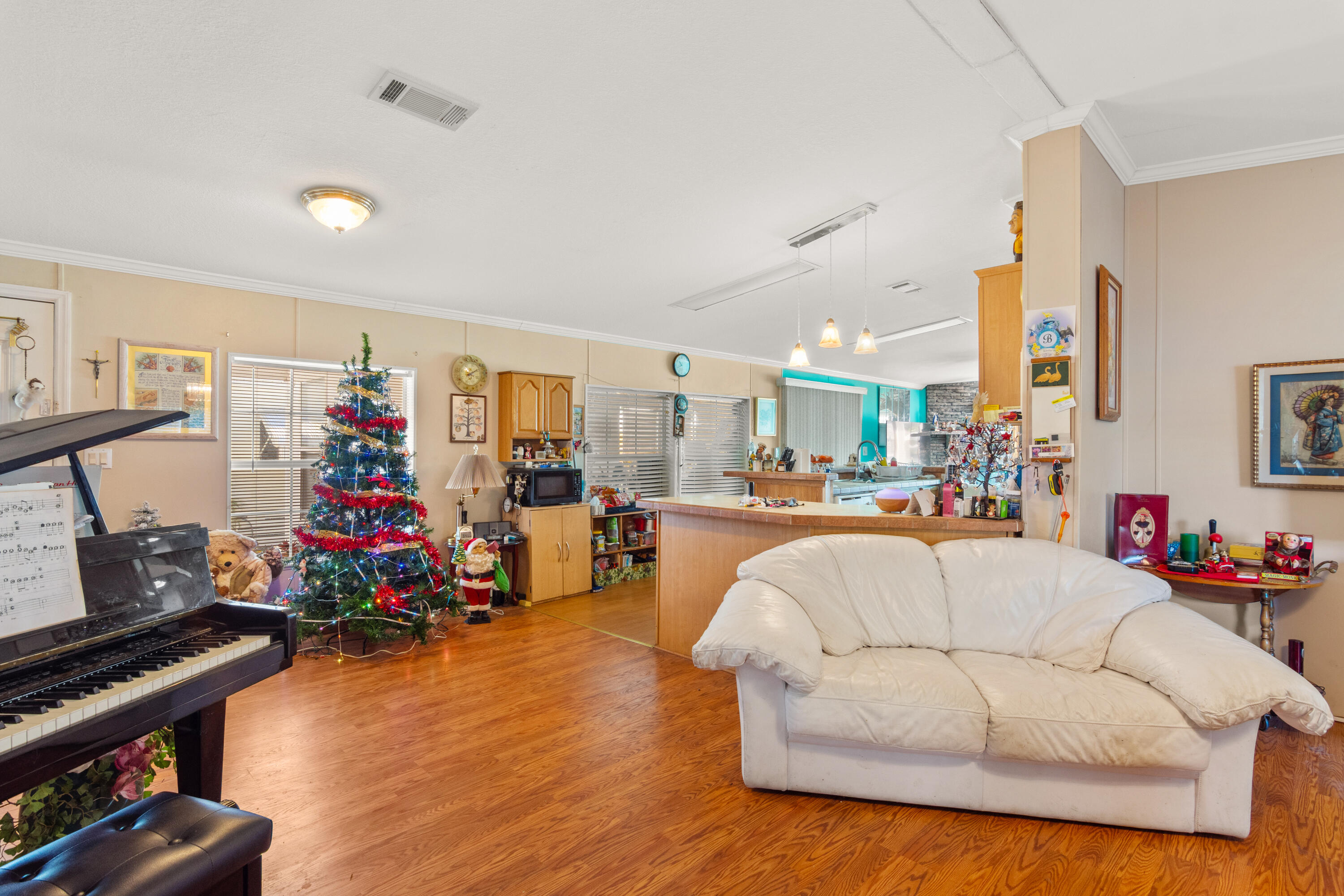 18 Nuevo Leon Road Port St. Lucie, FL 34952 - Photo 2 of 36 a living room with furniture and a wooden floor
