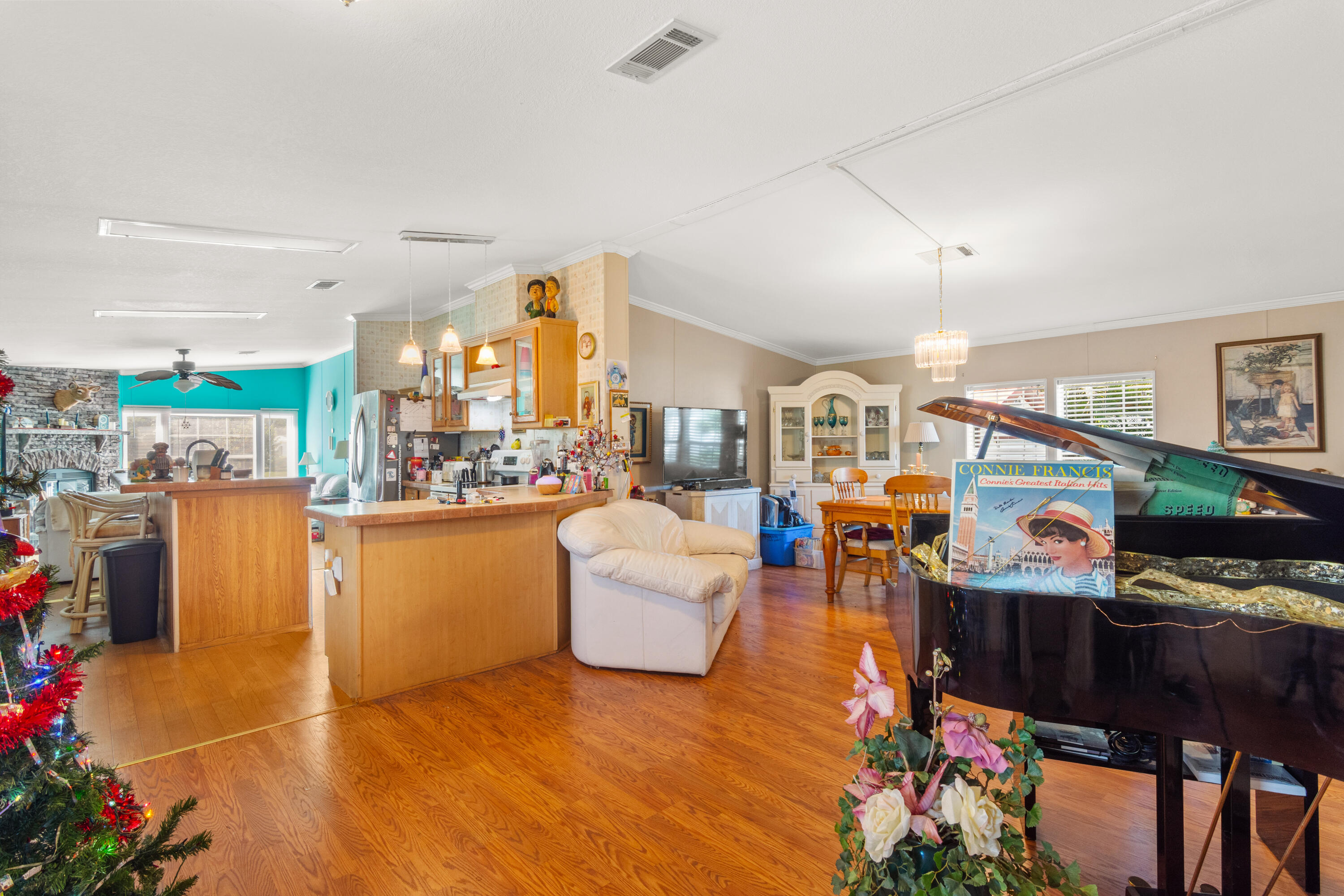 18 Nuevo Leon Road Port St. Lucie, FL 34952 - Photo 3 of 36 a living room with furniture and a flat screen tv