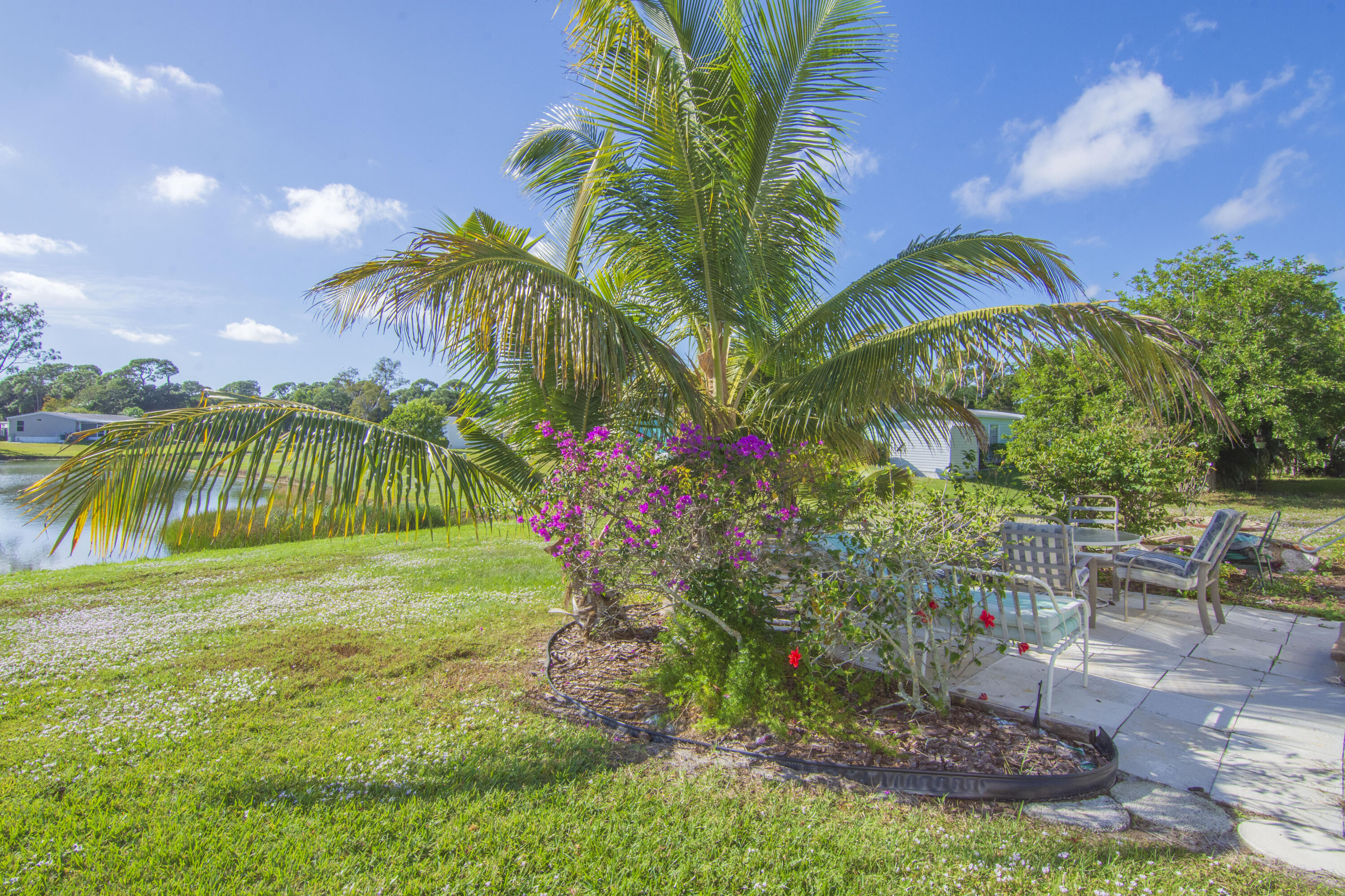 18 Nuevo Leon Road Port St. Lucie, FL 34952 - Photo 35 of 36 a view of a backyard