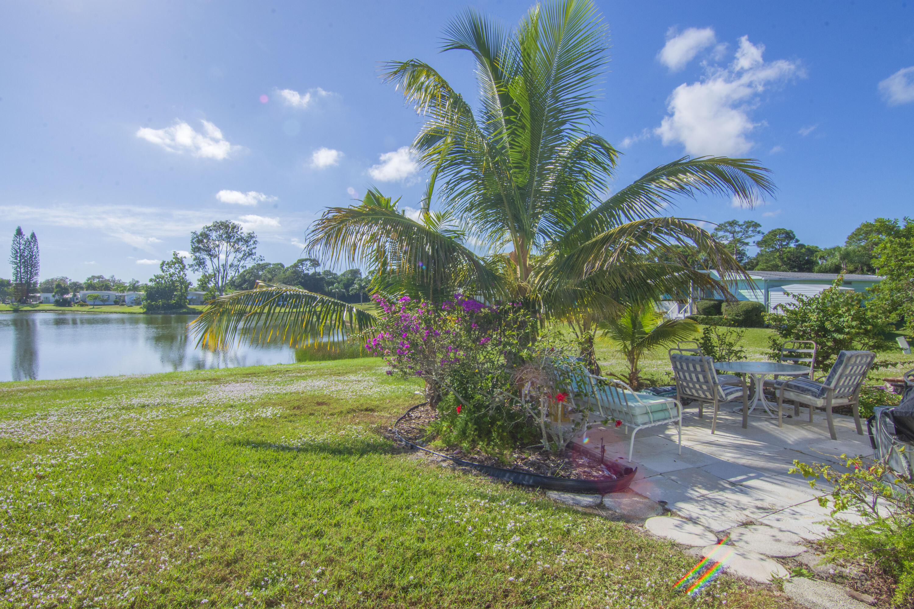 18 Nuevo Leon Road Port St. Lucie, FL 34952 - Photo 36 of 36 a view of a lake with a yard