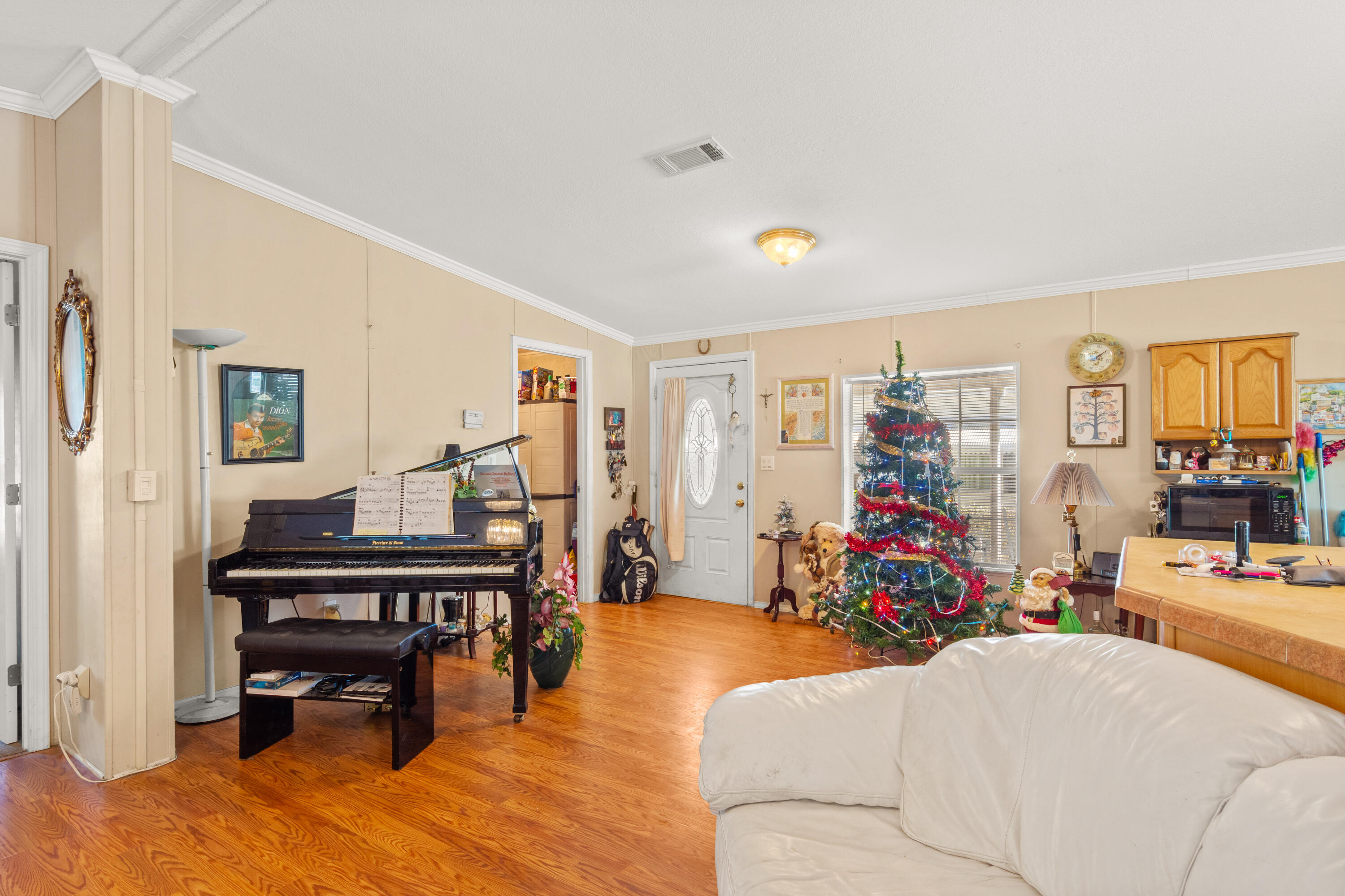 18 Nuevo Leon Road Port St. Lucie, FL 34952 - Photo 5 of 36 a living room with furniture and a piano
