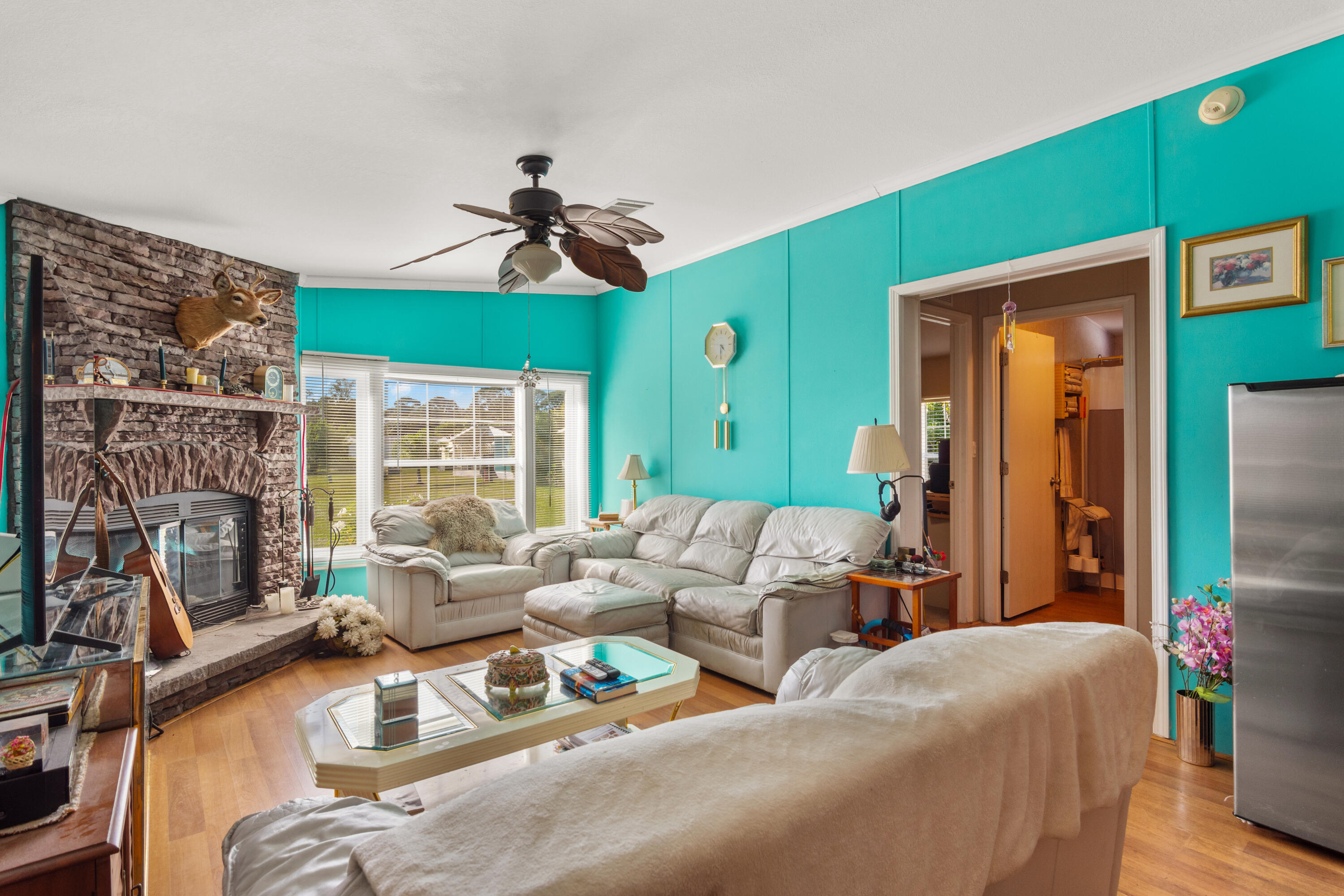 18 Nuevo Leon Road Port St. Lucie, FL 34952 - Photo 10 of 36 a living room with furniture ceiling fan and a window
