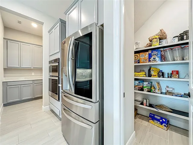 a dining room with a table and chairs