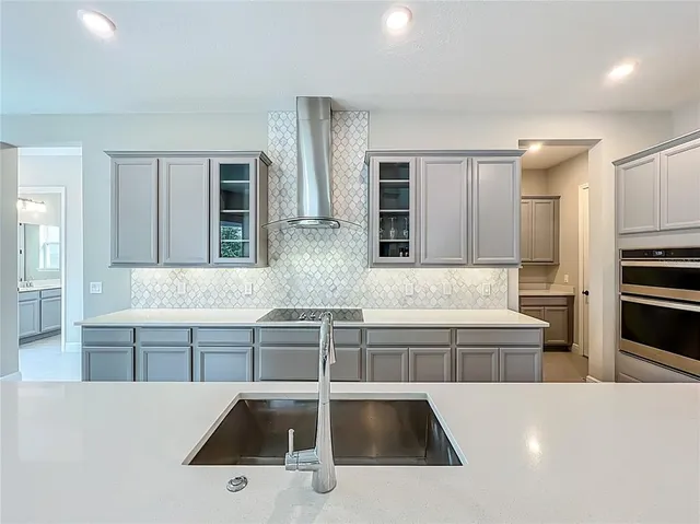 a bedroom with a bed and a ceiling fan
