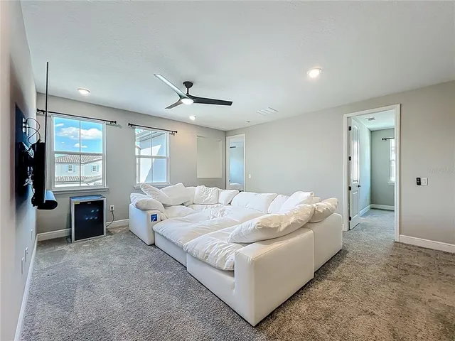 a spacious bathroom with a double vanity sink a mirror and a shower