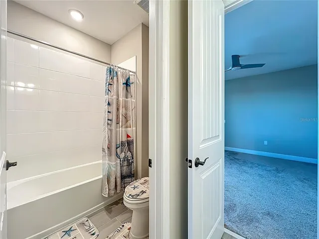 a backyard of a house with a garden and deck