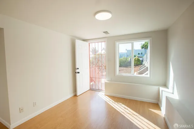 a view of an empty room with a window