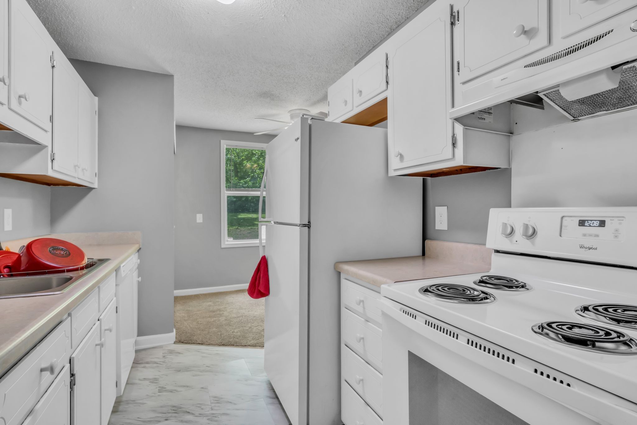 224 Warrior Road Madison, TN 37115 - Photo 8 of 27 a kitchen with a stove and a white refrigerator