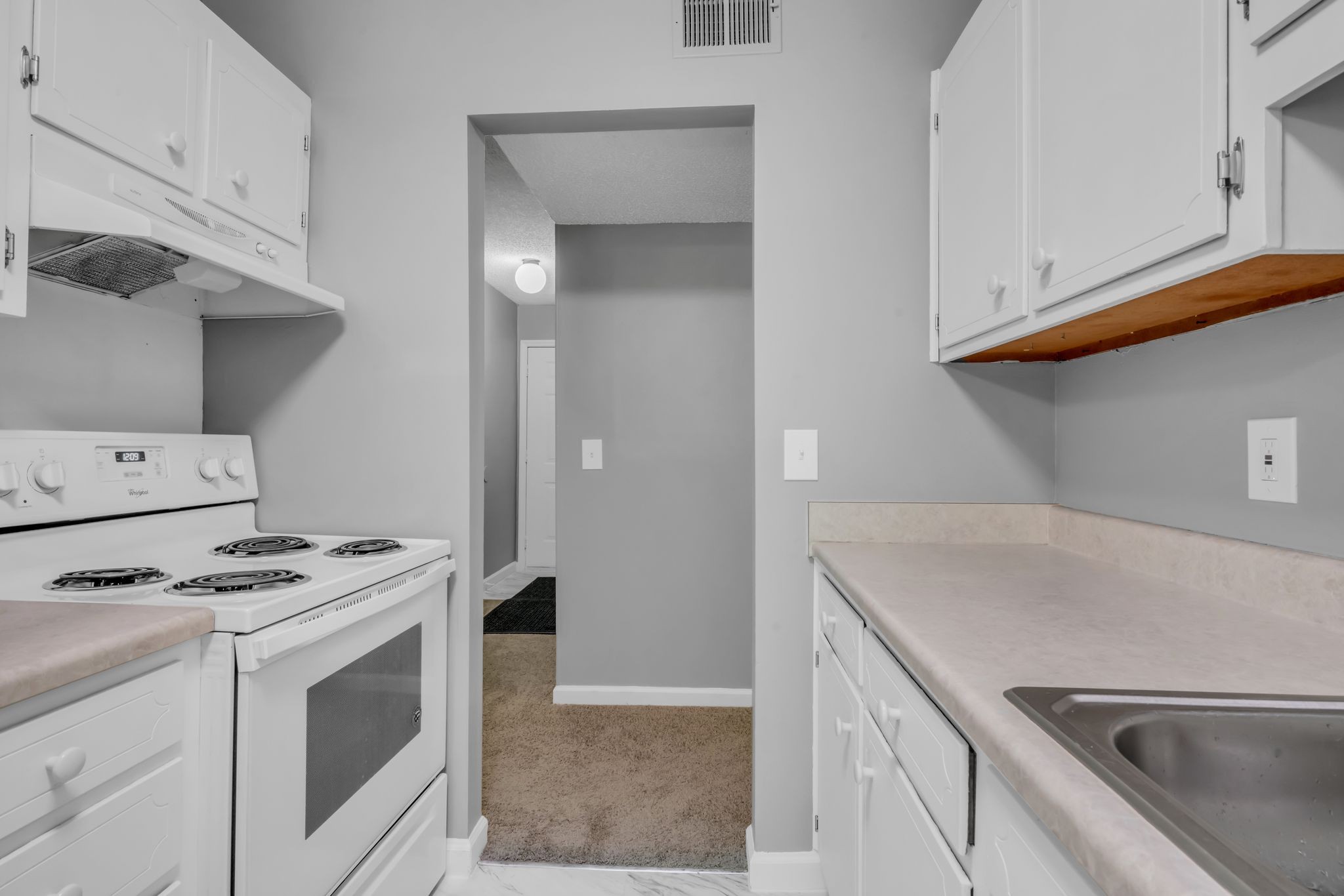 224 Warrior Road Madison, TN 37115 - Photo 10 of 27 a kitchen with granite countertop a sink and a stove