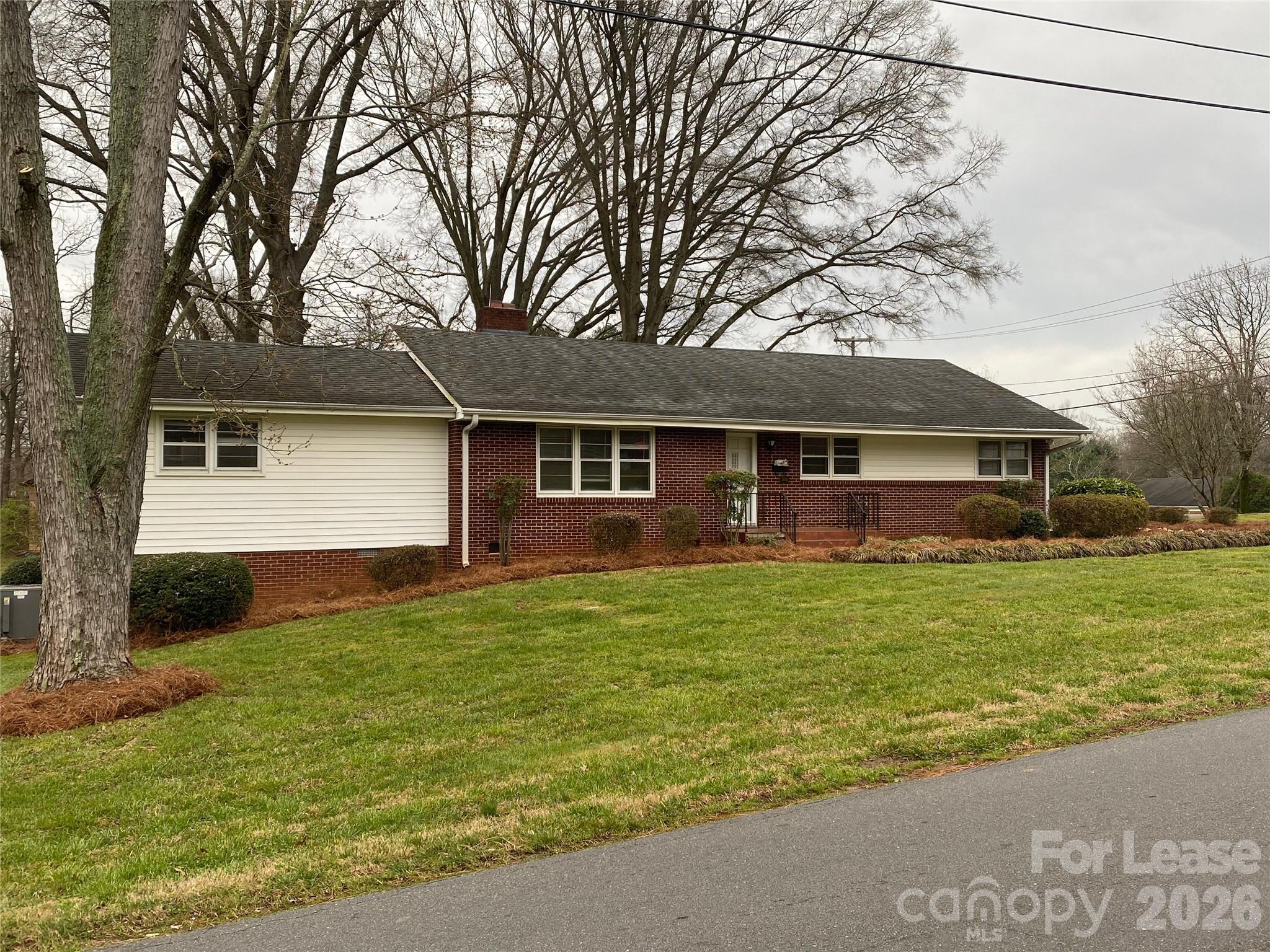 508 Dunham Road Gastonia, NC 28054 - Photo 2 of 16 a front view of a house with a garden