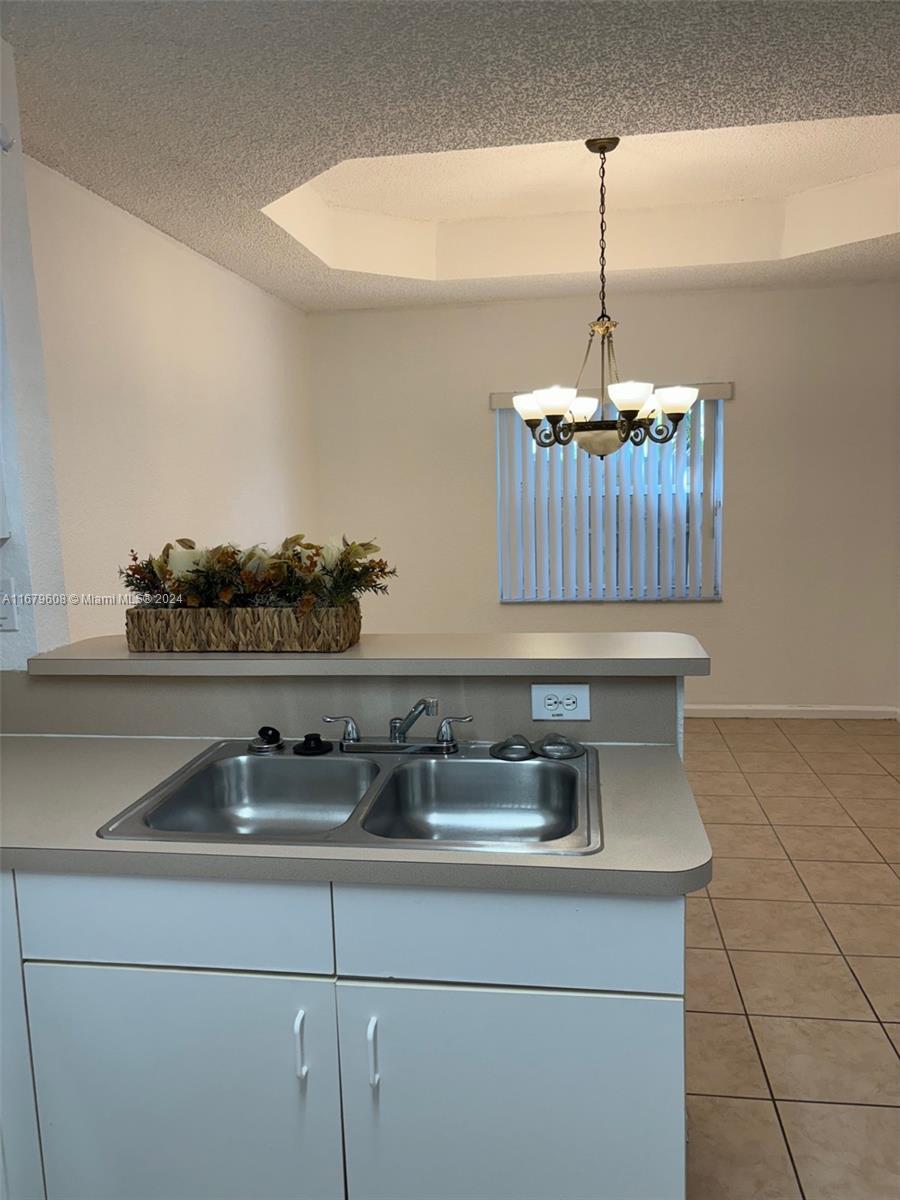 Three Lakes Miami, FL 33186 - Photo 12 of 34 a kitchen with a sink and cabinets