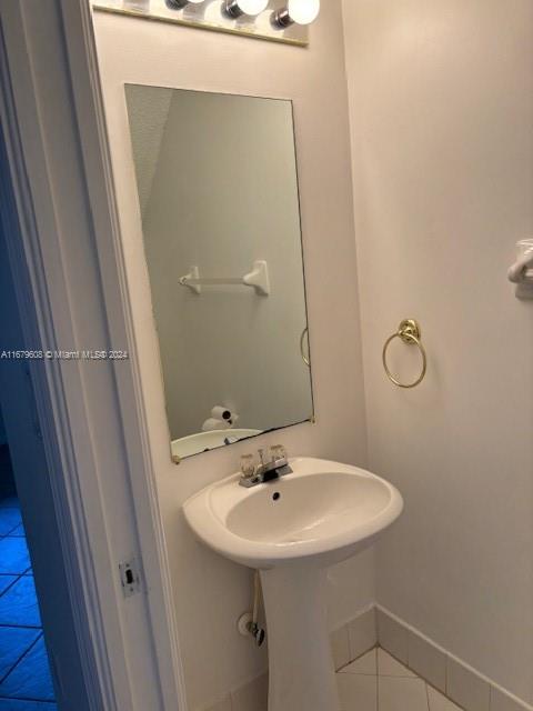 Three Lakes Miami, FL 33186 - Photo 15 of 34 a bathroom with a sink a mirror and a shower
