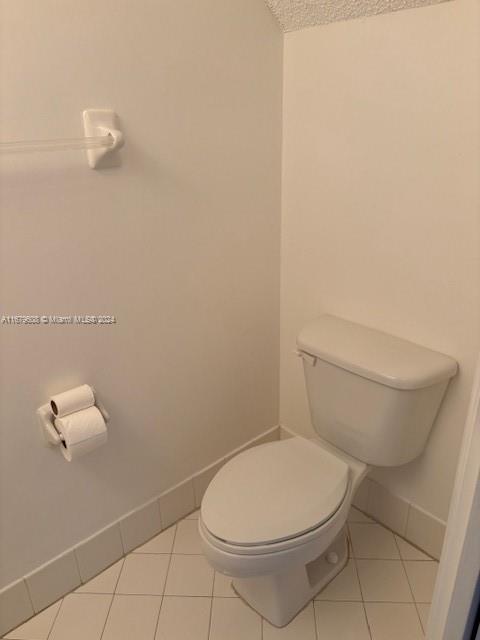 Three Lakes Miami, FL 33186 - Photo 16 of 34 a white toilet sitting next to a white sink