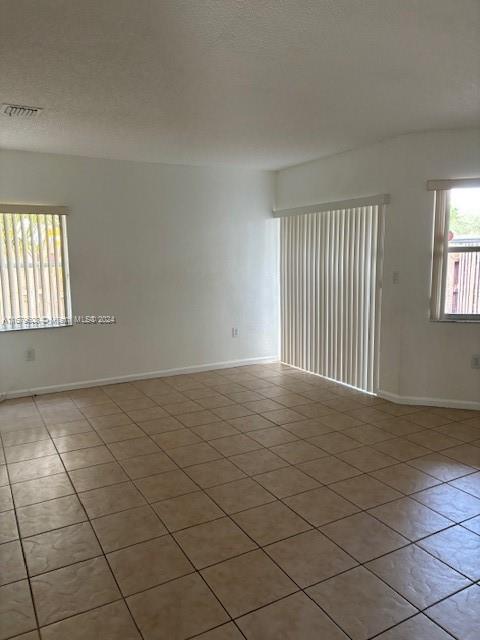 Three Lakes Miami, FL 33186 - Photo 6 of 34 an empty room with windows