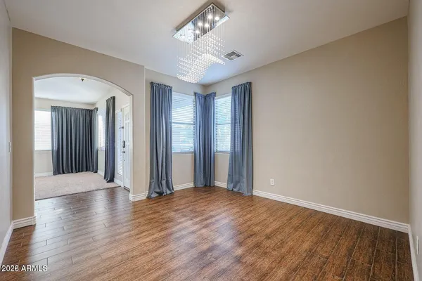 a view of livingroom with hallway and wooden floor