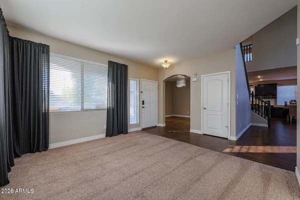 a view of a livingroom with wooden floor and a cabinet
