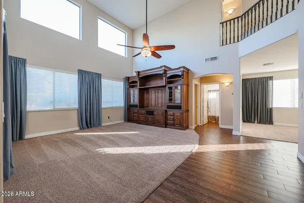 a view of a living room with wooden floor
