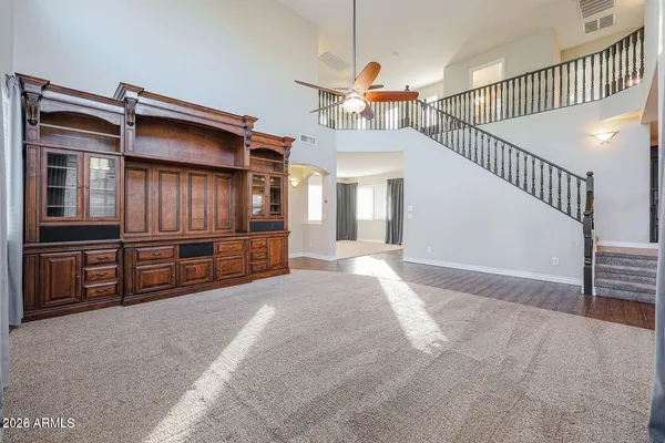 a kitchen with stainless steel appliances granite countertop a sink and a microwave