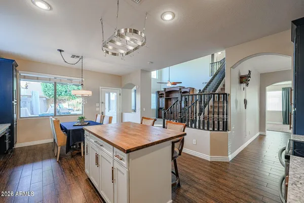 an empty room with a window and a ceiling fan