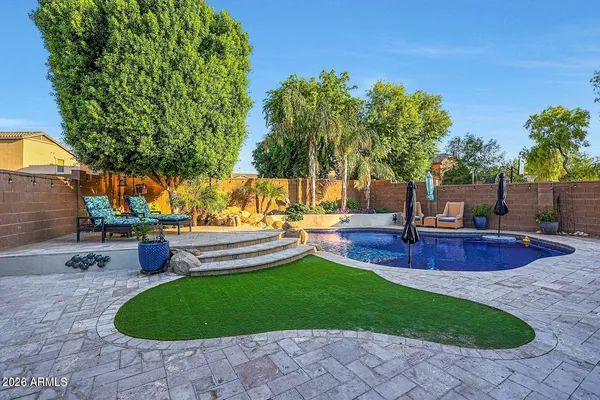 a view of a swimming pool with a patio