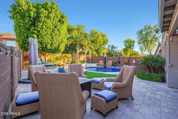 a view of a patio with couches chairs and a table and chairs