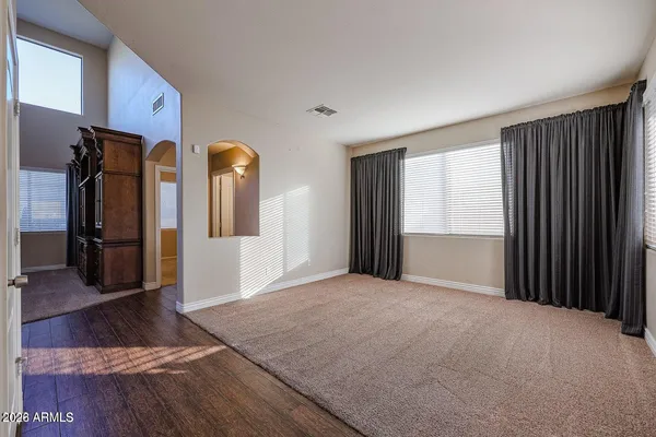 a view of an empty room and a window