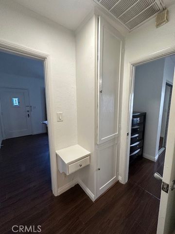 a view of a room with wooden floor and closet