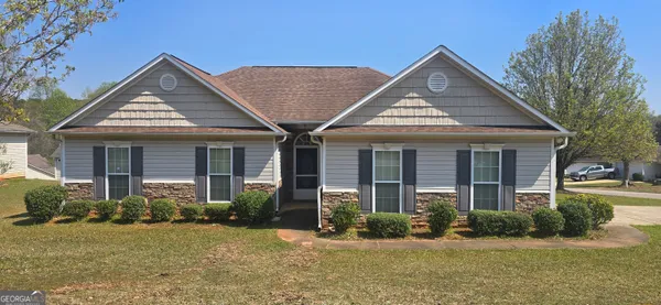 front view of a house with a yard